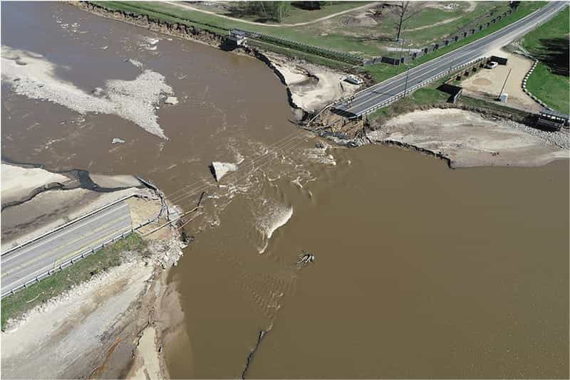 Aerial imagery shows the M30 causeway bridge completely destroyed by the flooding.