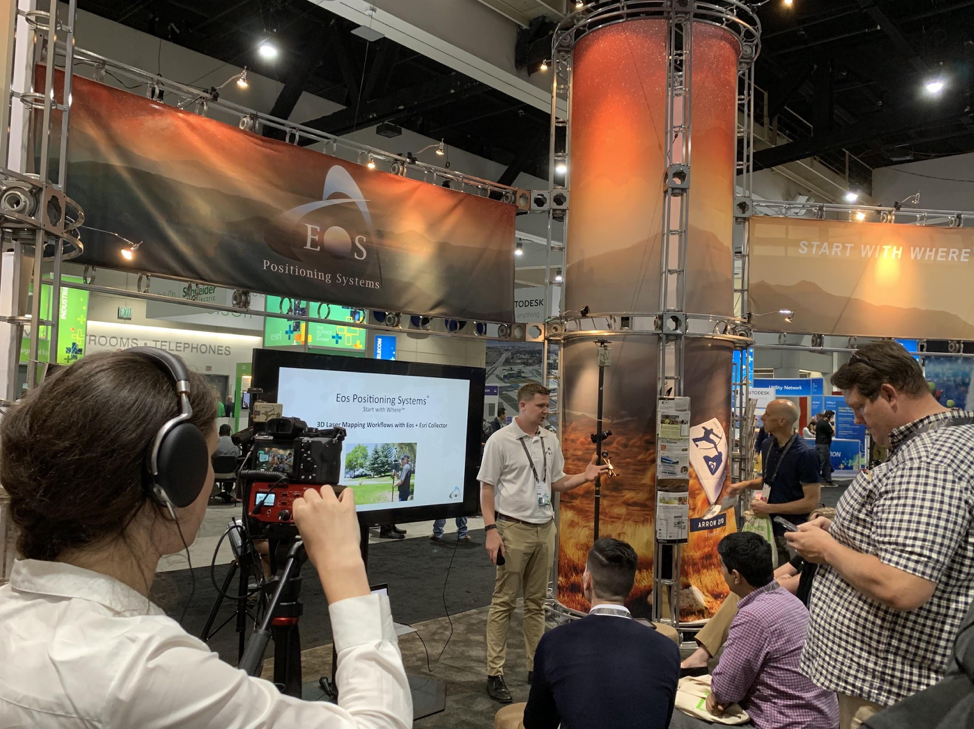 Eos Multimedia Producer Emma Hardy records a Laser GIS demonstration in the Eos booth at the 2019 Esri UC