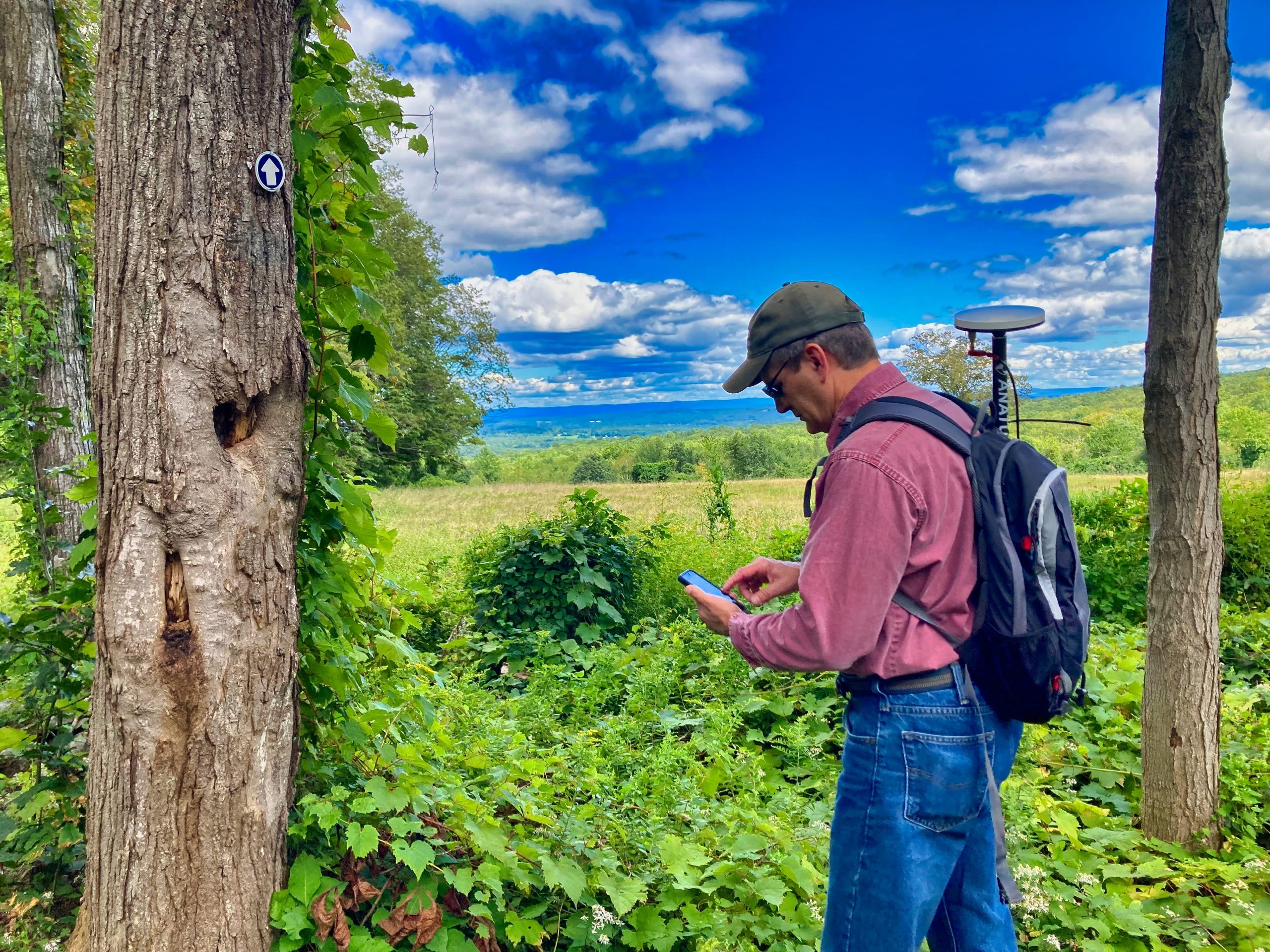 Steve Perry collects high accuracy GNSS GPS data in the field for a land trust conservatorory using Esri ArcGIS Field Maps