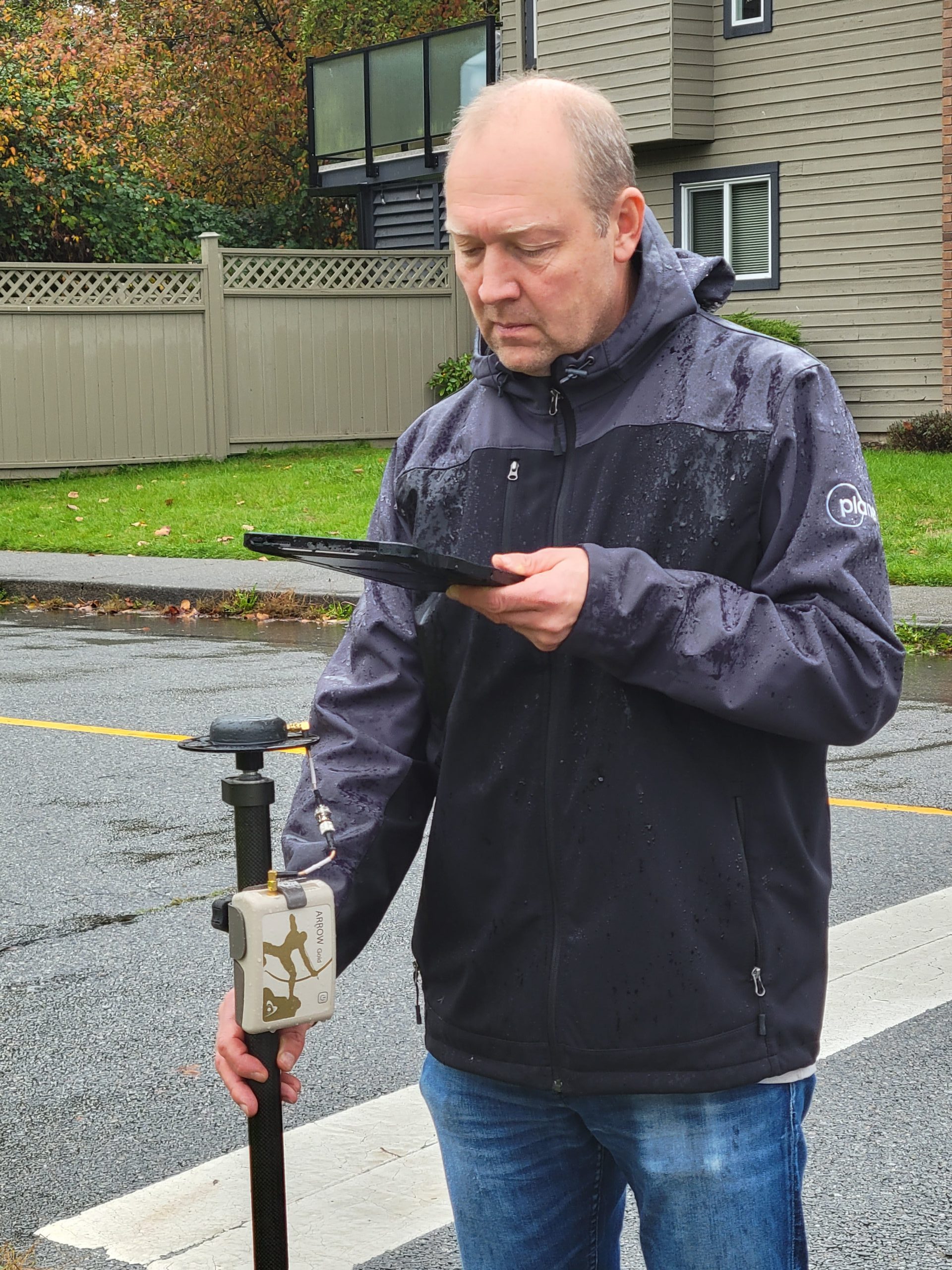 Dmitri Bagh Customer Spotlight 3 - Dmitri Bagh Looks at iPadPro for Data Collection while holding Eos Arrow GNSS Receiver on Range Pole