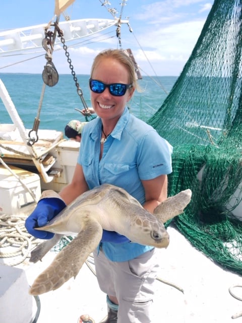 Customer Spotlight Amber Kuehn Holding Endangered Sea Turtle