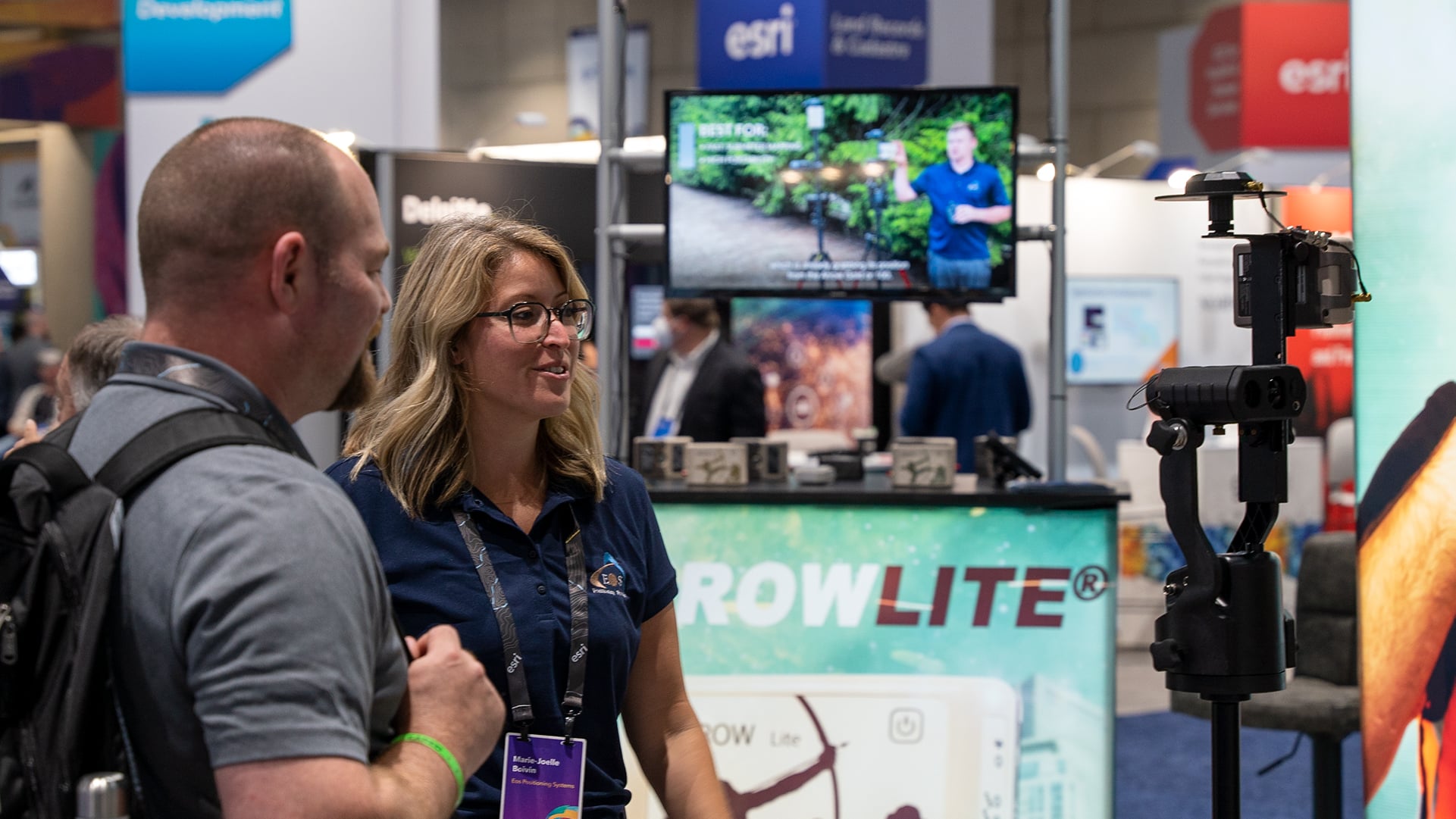 Marie-Joëlle Boivin speaks to a customer at the Eos Esri UC booth