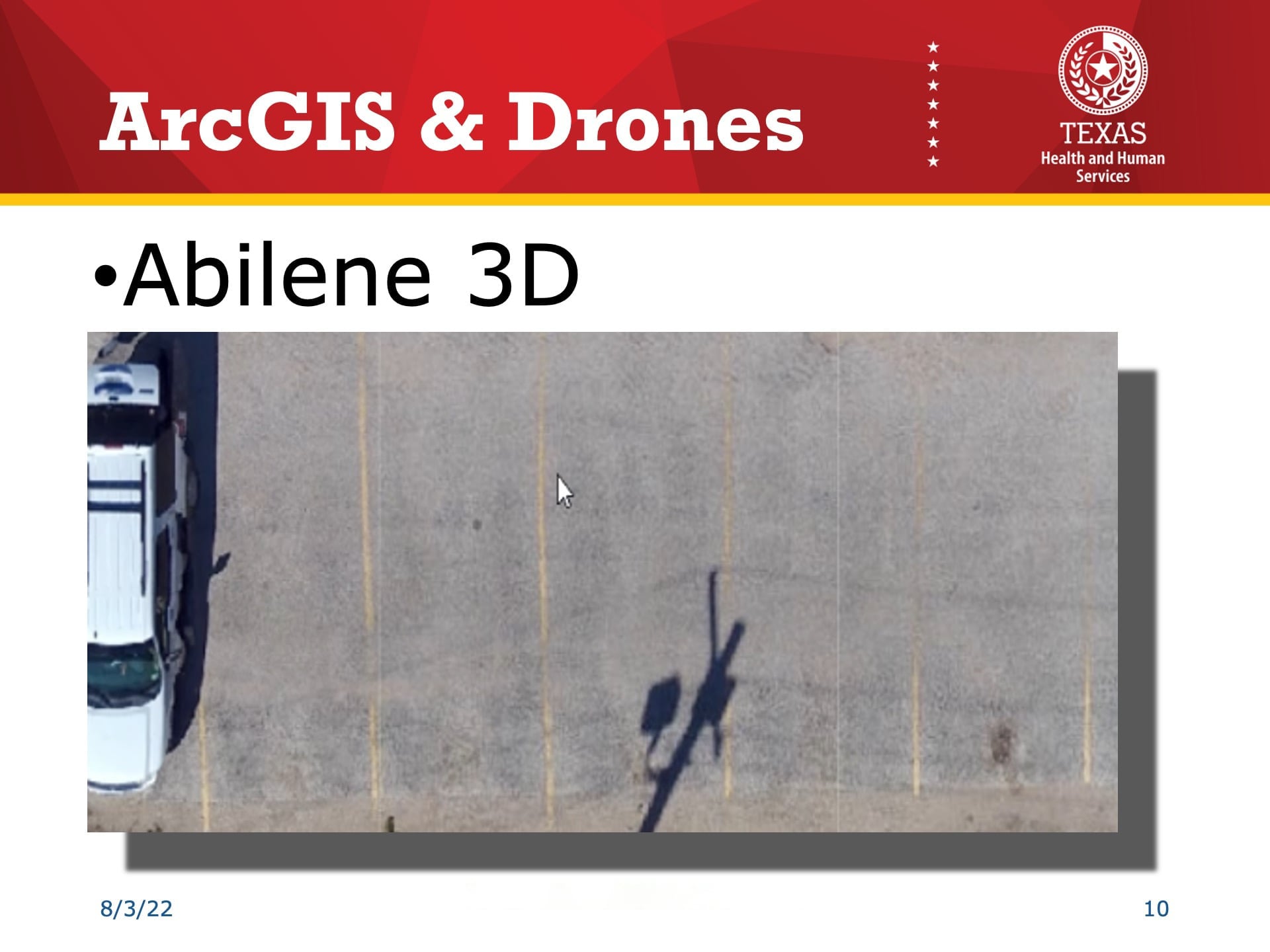 Esri UC 2022 Slide Reading: "ArcGIS & Drones: Abilene 3D" shows a close up of the parking lot, where you can visibly see the yellow parking lot lines.