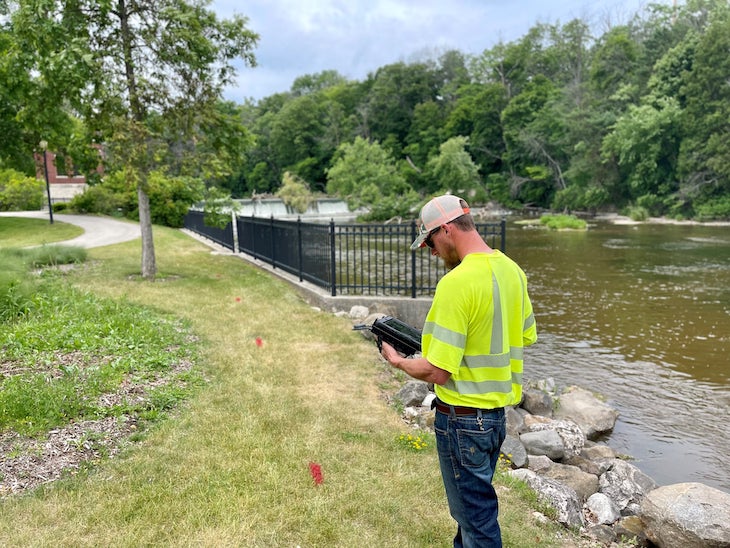 City of Sheboygan Falls Utilities worker maps primary underground linear assets with submeter accuracy. Points (marked in red spray paint) were later digitized into lines, using the ArcGIS snap feature.