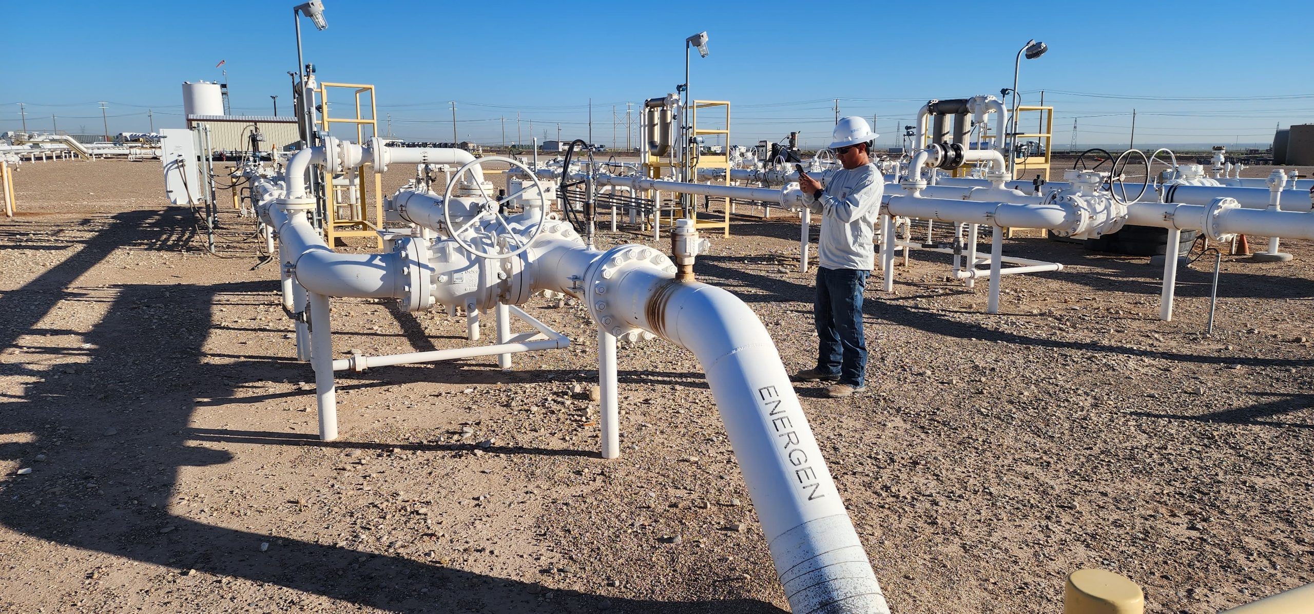 Kinetik Pipeline Technician II Nathan Trejo captures information about a pipeline launcher at Kinetik’s Stampede Terminal, South Apalousa pipeline, GNSS, ArcGIS, pipeline mapping