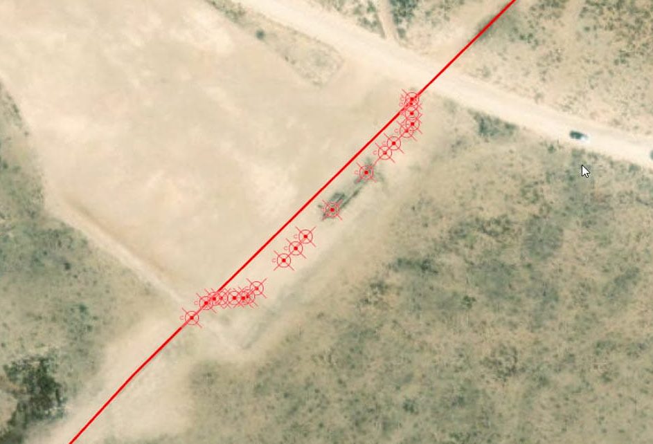 Field-verified points (shown as red cross-hairs) show that the buried pipeline does indeed bend, matching the imagery