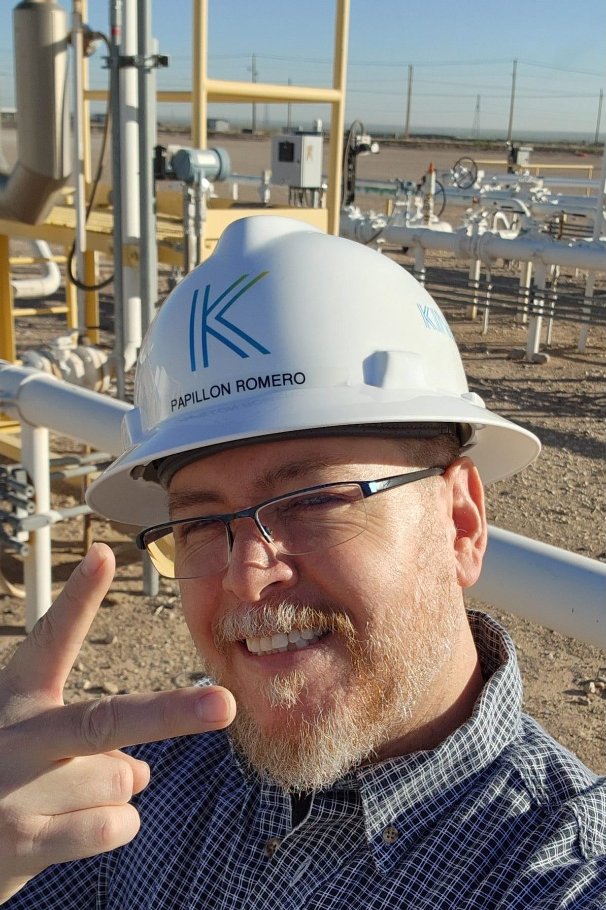Papillon Romero, GIS Manager at Kinetik, smiles in the field while collecting high-accuracy pipeline data