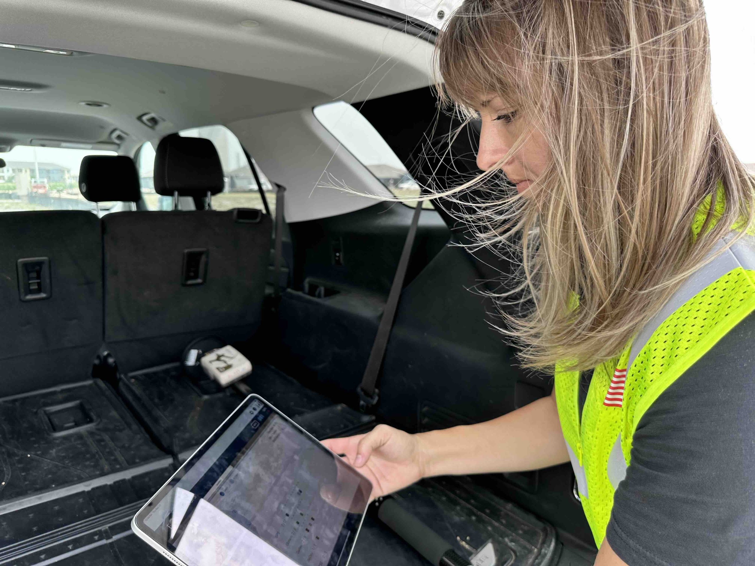 City of Seguin Utility Data Analyst Felecia Helms with Arrow Gold and Eos Tools Pro on iPad in Hannah Heights, Seguin, Texas