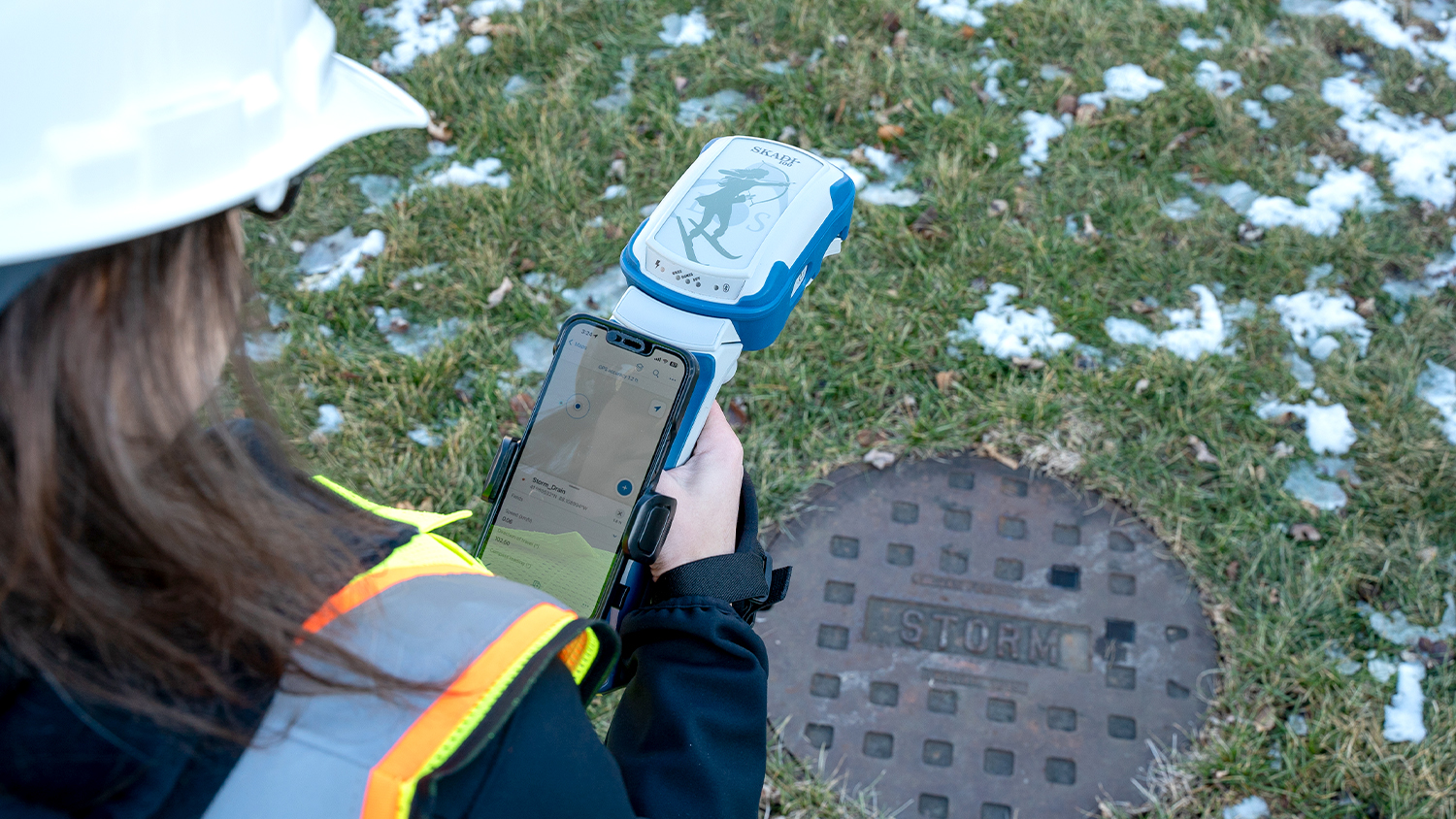 Eos Postioning Systems Handheld Skadi 100 GNSS Receiver Mapping Stormwater Manhole in the Field