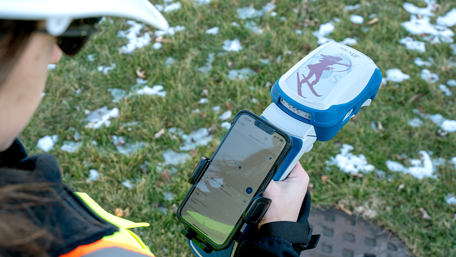 Eos Positioning Systems Skadi 300 Handheld GNSS Receiver Mapping Stormwater Manhole in the Field