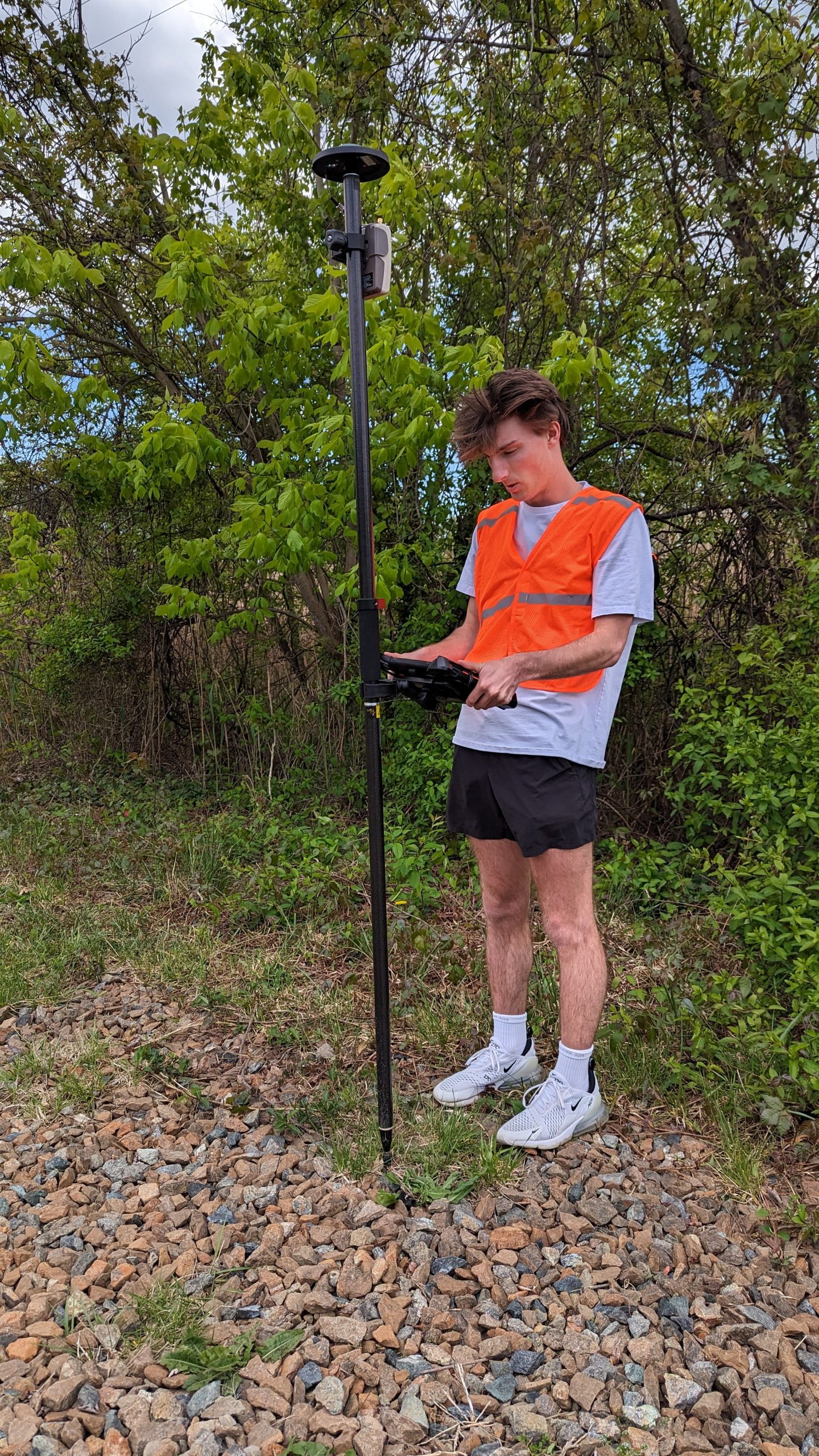 Washington College undergraduate Dyllan Bishop (‘24) maps a trail at Tuckahoe State Park while using an Arrow Gold GNSS receiver, ArcGIS Field Maps, and an iPad. This field work comprised a portion of Bishop’s Geospatial Innovations Program internship project, which also included desktop work to polish the final maps. The internship was paid and gave Bishop real-world GIS experience—while also helping the park achieve its goal of providing visitors with an updated, accurate map of all 19 park-managed hiking trails.