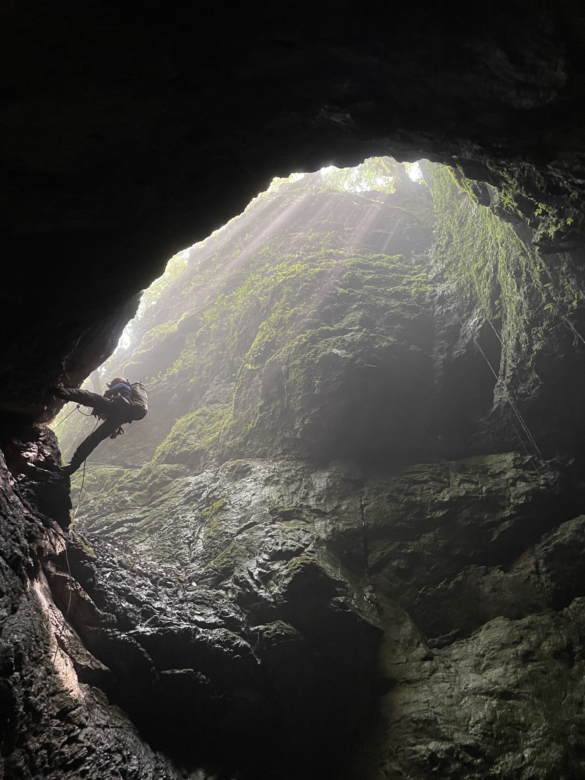 Proyecto Espeleológico Sistema Huautla (PESH) co-founder Thomas Shifflett rappels down the Cueva de Elysium cave entrance, which was discovered in 2019.