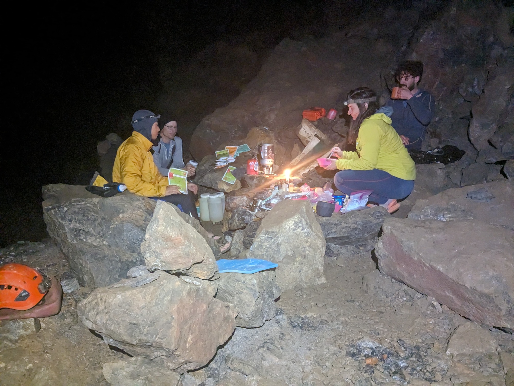 From left to right: PESH cavers Alec Matheus, Jeff Gaben, Tristan Stahl, and Georgia Schneider congregate in Camp Berta, an underground camp in Cueva Elysium. (Photo by Tommy Shifflett during the April 2024 expedition)