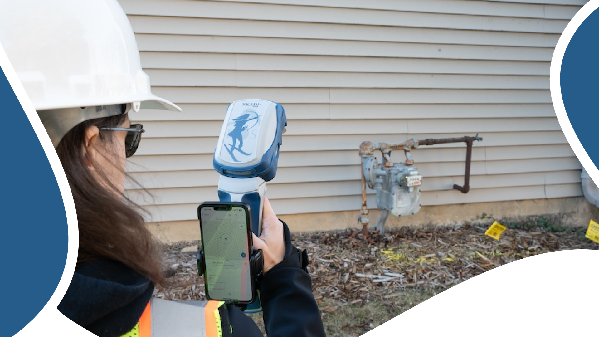 Field worker using the Extensible Virtual Range Pole from Eos Positioning Systems to survey the position of a residential gas meter from afar with RTK accuracy, Skadi 200 GNSS receiver