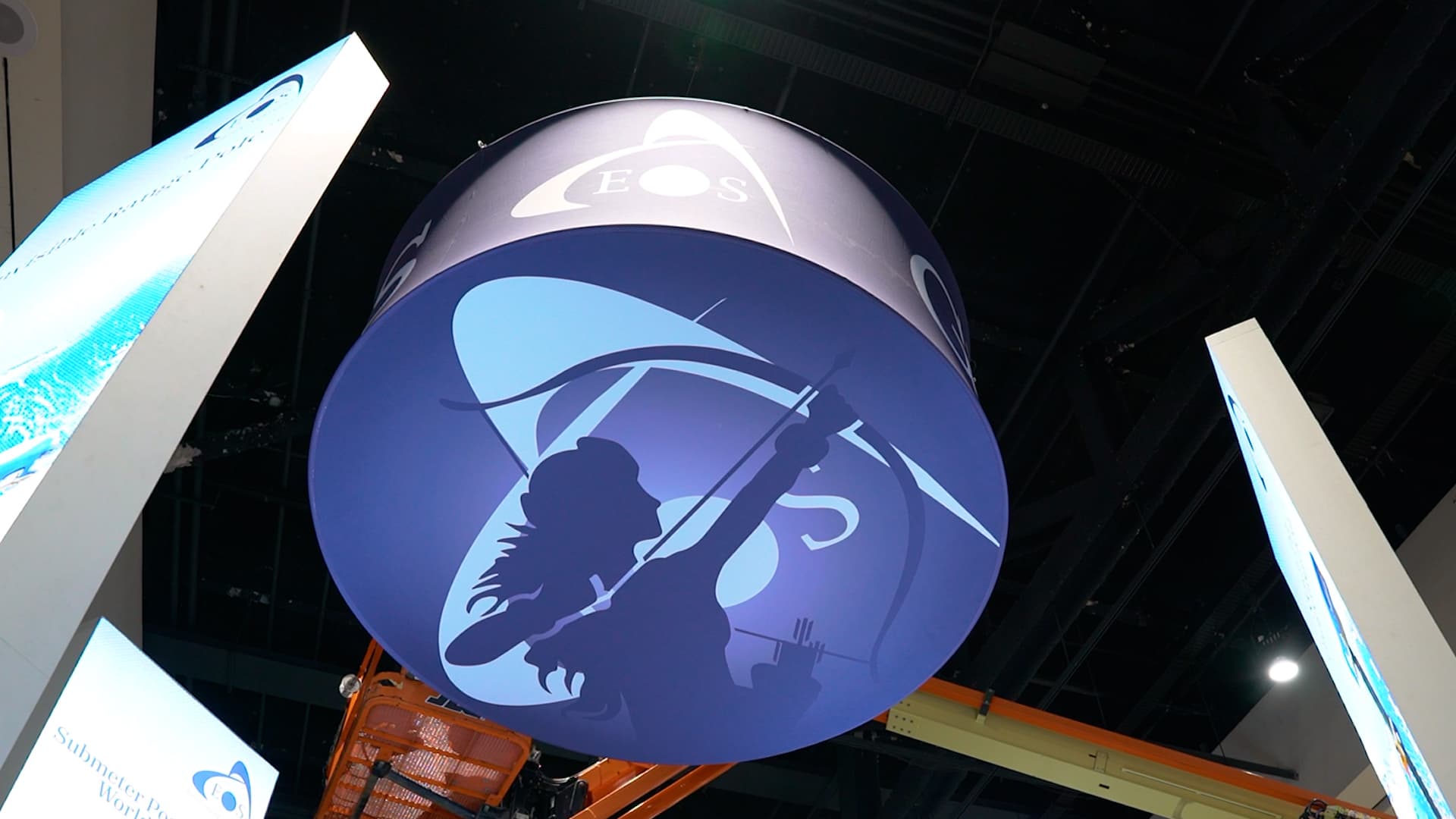 04 - Skadi Banner Construction copy Right after the plenary, Skadi took to the sky in the expo hall, ready to fly the Eos flag for all GIS users curious about getting higher accuracy in their Esri apps.