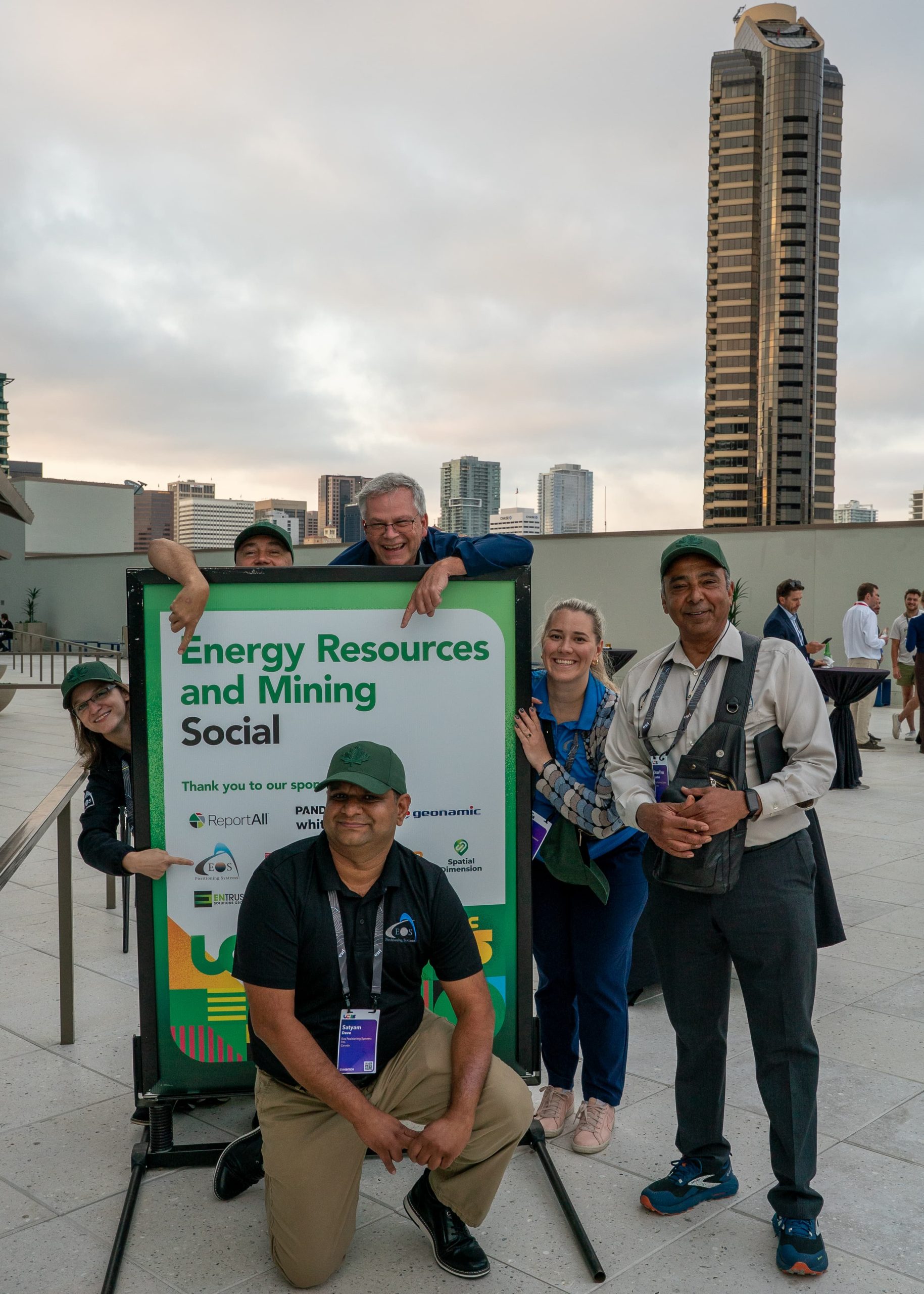 25 - Energy and Mining Resources Social copy Eos team members channeled their inner Brady Bunch and posed with the sponsor sign at the Energy Resources and Mining Social.