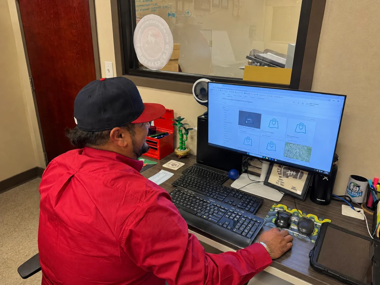 Eagle-Pass-Water-Works-System-desktop-GIS-1 EPWWS GIS Technician Julian Villareal uses ArcGIS Online in the office.